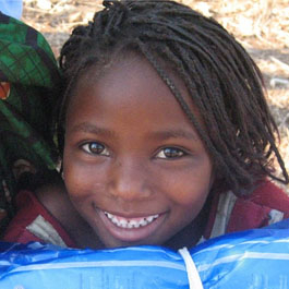 Against Malaria Foundation girl with nets